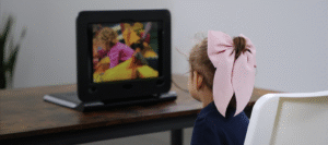 girl looking at diagnostic device screen